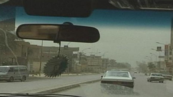 The team drove through the streets of Baghdad