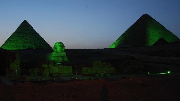The pyramids and sphinx are among several landmarks illuminated in green for the celebration.