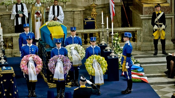 Members of the Royal Guard hold wreaths in the Royal Chapel of the Royal Palace of Stockholm
