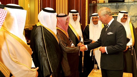 The Prince of Wales talks to members of parliament in the Shura parliament building