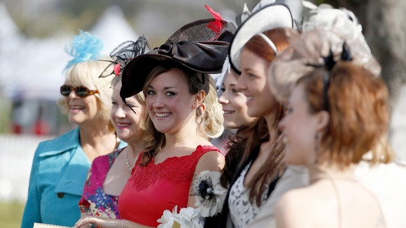 Aimee Fardell from Leicestershire (centre) arrives for Ladies Day with friends for her 'Hen Do'
