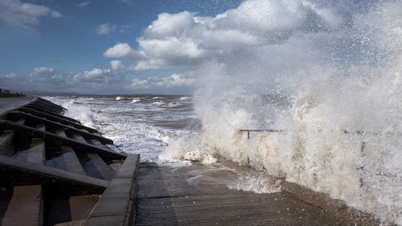 Big waves crash against the shore