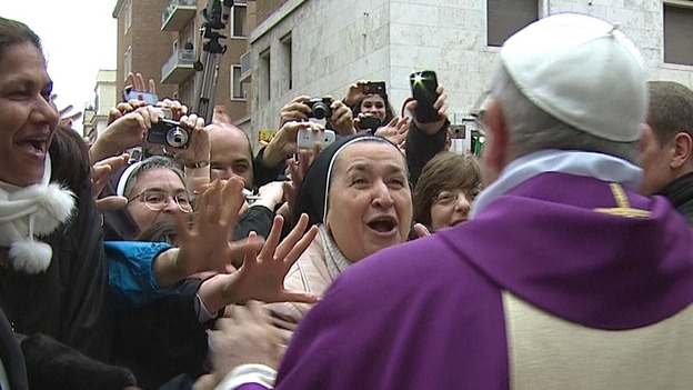 Newly elected Pope Francis greets crowds gathered in the Vatican