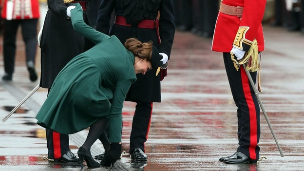 Kate freeing her heel as it gets stuck in a drain