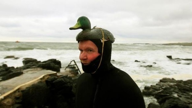 A man dressed in fancy dress to raise money on St Patricks Day for local charities in the town of Portstewart.