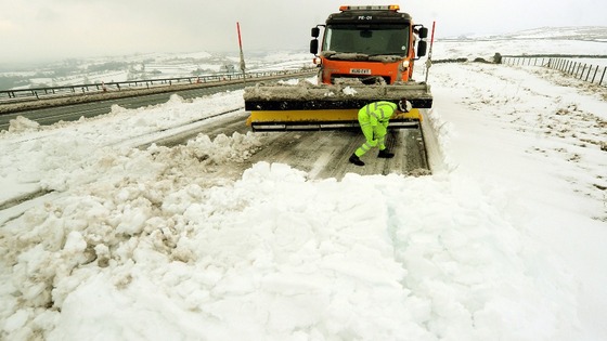 A snow plough clears the A66 near Bowes, County Durham