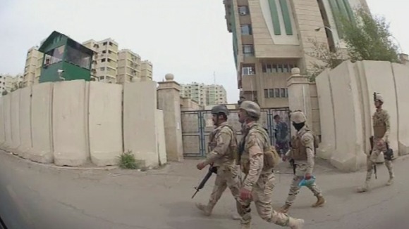 Military patrols through central Baghdad