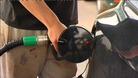 Man fills up his car with petrol