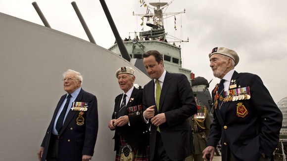 Prime Minister David Cameron speaks with WWII veterans