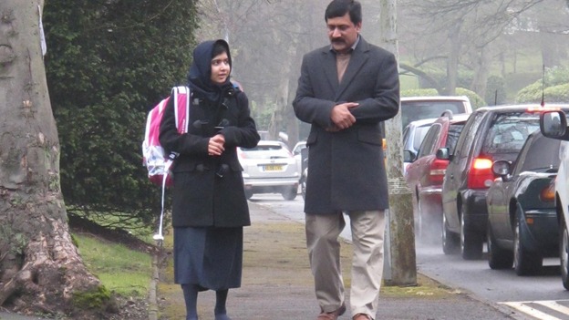 Malala Yousafzai walks to school for the first time since she was attacked by the Taliban in October.