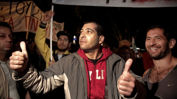 Anti-bailout protesters smiled and cheered as news of the vote came through.