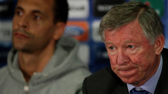 Manchester United's manager Sir Alex Ferguson (right) sits alongside Rio Ferdinand