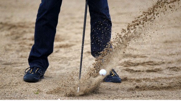 A person playing golf.