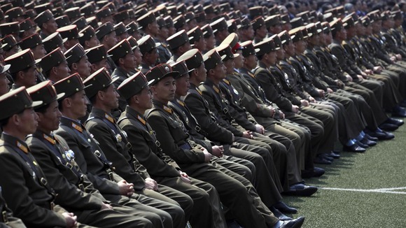 Military members attend a mass meeting called by the Central Committee of North Korea's ruling party.