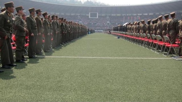 Military members attend a mass meeting called by the Central Committee of North Korea's ruling party.