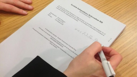 Scotland's Deputy First Minister Nicola Sturgeon signs the independence referendum Bill.