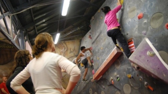 Climbers on a climbing wall.