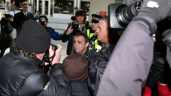 Michael Le Vell, arrives amongst a scrum of media at Manchester Crown Court