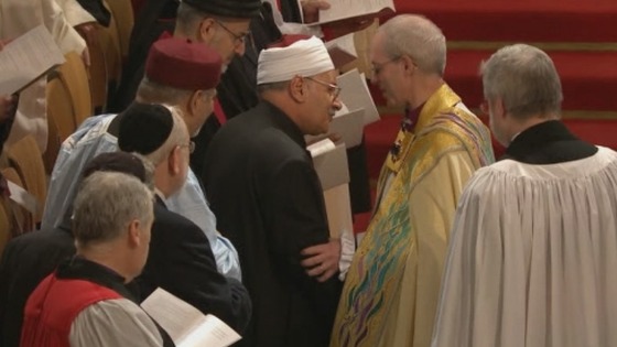 Archbishop of Canterbury Justin Welby shakes hands at his enthronement.