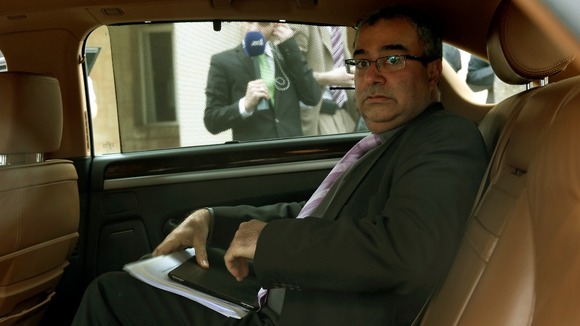 Cyprus Central Bank Governor Panicos Demetriades seen leaving the Presidential Palace on Thursday