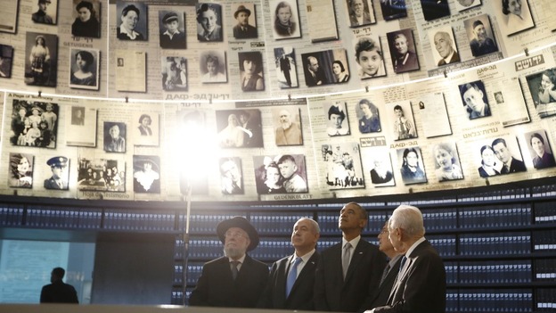 President Obama (C) tours the Hall of Names which commemorates millions of Jews murdered during the Holocaust