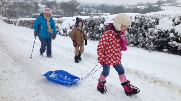 Family in the snow in Coedporth near Wrexham
