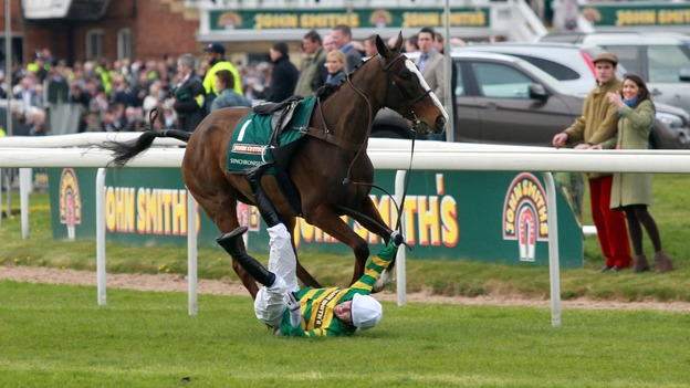 Tony McCoy falls from Synchronised before the John Smith's Grand National Steeple Chase