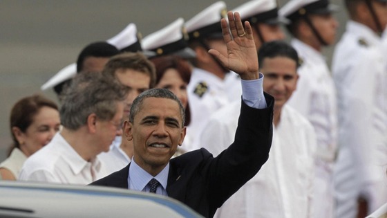 President Barack Obama waves upon arrival to Cartagena, Colombia, Friday April 13, 2012