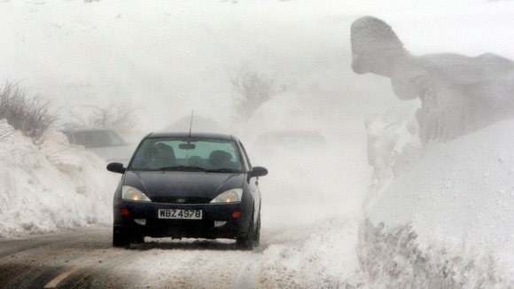 Motorists battle through blizzards and drifting snow in the hills above the Glens of Antrim, Northern Ireland.