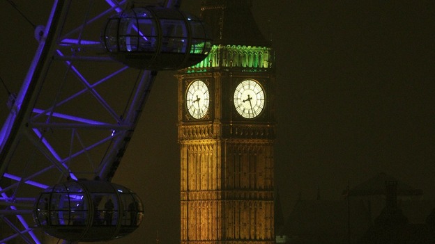 Elizabeth Tower, which houses Big Ben in London, illuminated prior to the light being turned off to mark WWF's Earth Hour 2013