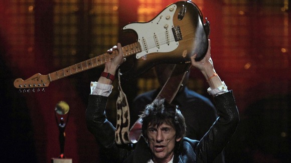 Ronnie Wood celebrates after the finale of the 2012 Rock and Roll Hall of Fame inductions.