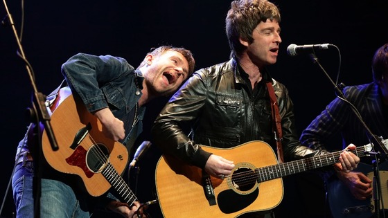 Damon Albarn and former musical foe Noel Gallagher perform together onstage for the Teenage Cancer Trust.