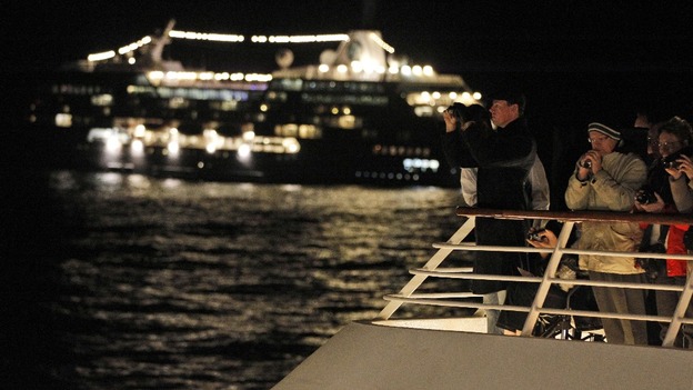 Passengers participate in a memorial service aboard the MS Balmoral.