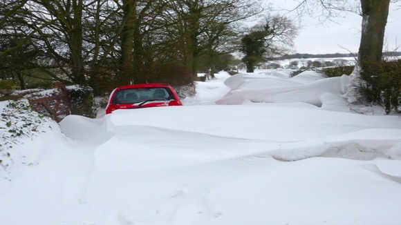 Cars stuck in drifting snow in Cheadle, Staffordshire.