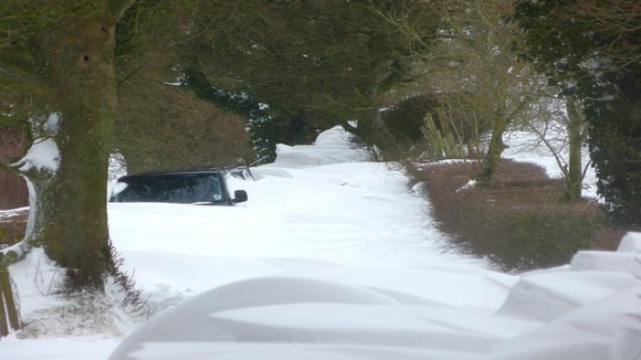 car stuck in snow drift