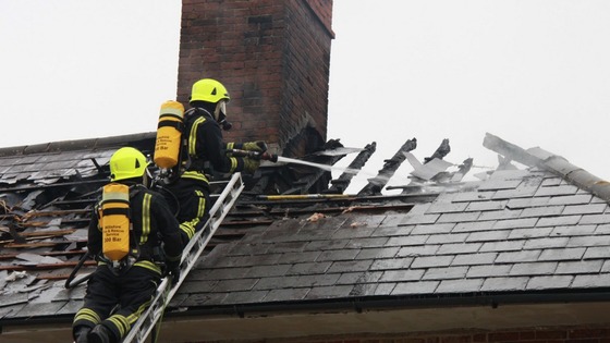 Firefighters tackle flames 