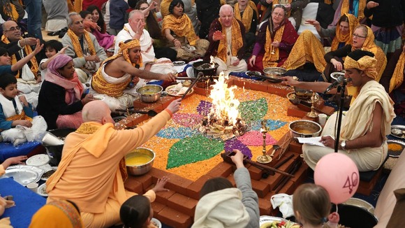 Members of the Hare Krishna congregation take part in a holy hindu ritual called Yajna.
