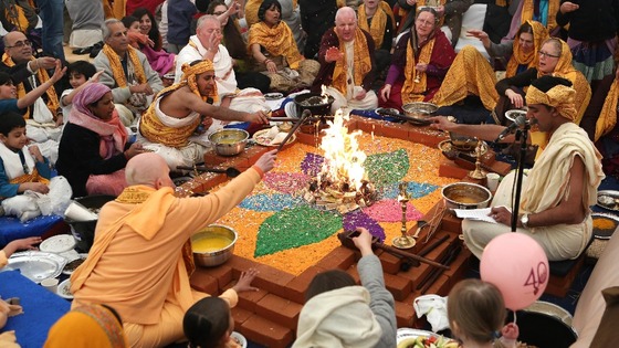 Members of the Hare Krishna congregation take part in a holy hindu ritual called Yajna.