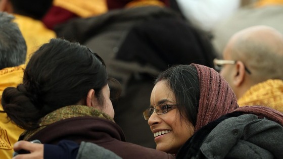 Two women greet each other during the holy hindu ritual.