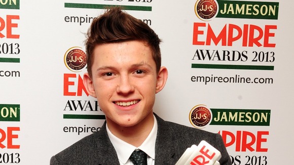 Tom Holland with his award.