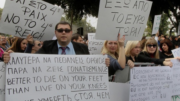 Protesters take part in an anti-bailout rally by employees of Cyprus Popular Bank in Nicosia on March 22.