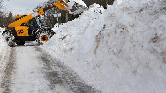 Workers begin clearing roads in Burnley