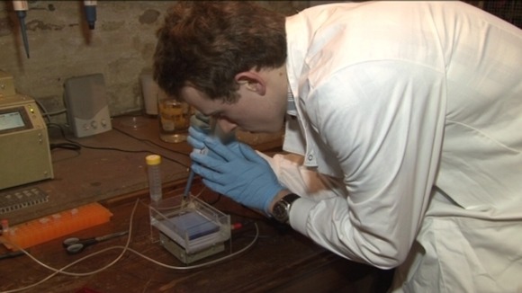 Fred Turner carrying out an experiment in his lab at home