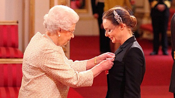 Designer Stella McCartney receiving her OBE from the Queen.
