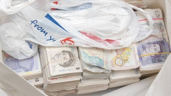 This cash was seized by police off the M62 in Leeds.