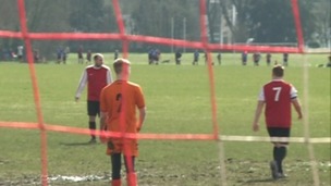 Footballers on a pitch
