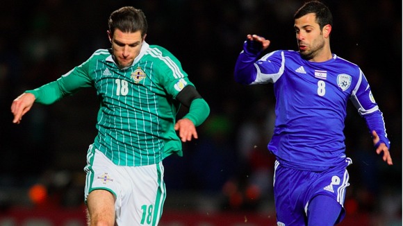 Northern Ireland's Aaron Hughes (left) battles with Israel's Eden Ben Basat.