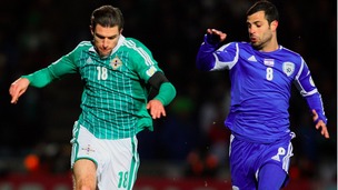 Northern Ireland's Aaron Hughes (left) battles with Israel's Eden Ben Basat.