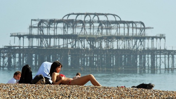 Sunbathers on Brighton beach in March 2012