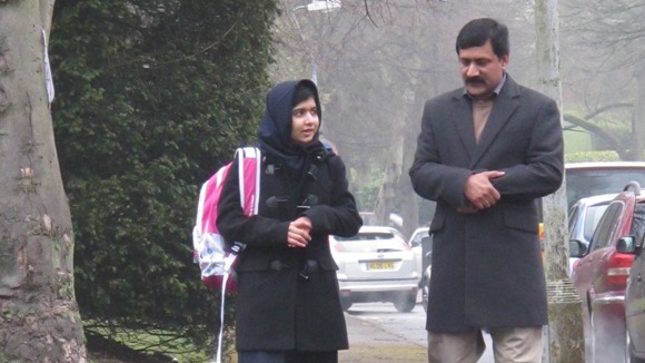 Malala with her father Ziauddin on her first day of school in the UK